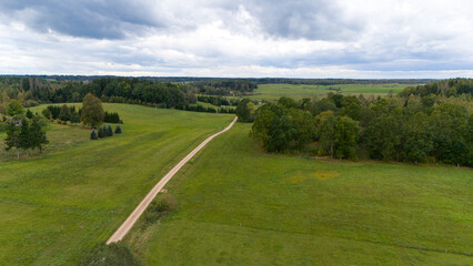 Fototapeta premium Aerial View of Rural Landscape with Dirt Road