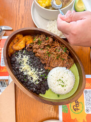 Venezuelan Pabellón criollo in wooden bowl