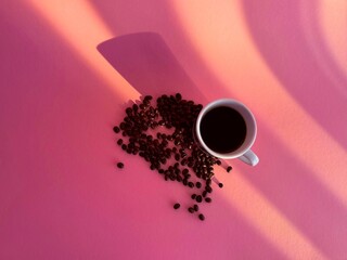 One coffee cup with Cappuccino on pink background. Espresso drink with foam. Copy space. High quality photo