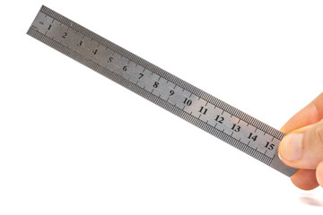 Hand holding a stainless steel ruler on isolated white background. 15cm metal ruler in hand....