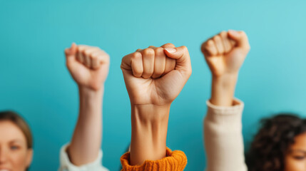 Diverse Hands Raised in Unity Against Blue Background for Empowerment