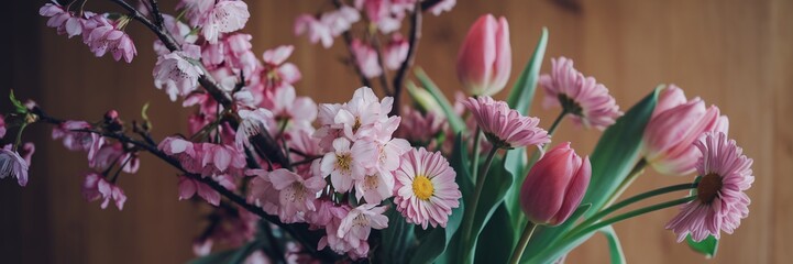 Spring Equinox,Floral Awakening, Pink Spring Flowers on Wooden Background