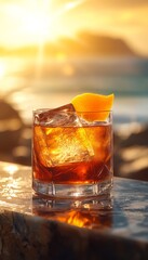 artisan whiskey cocktail in a glass on the beach