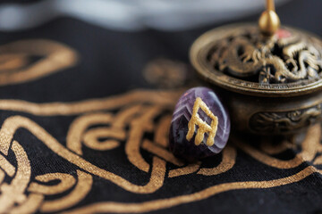 Scandinavian nordic culture symbol. Viking rune closeup.