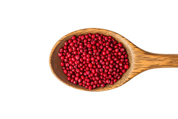 Red seeds in wooden spoon, studio shot, food ingredient