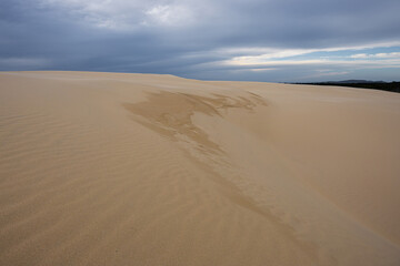 Sand dune with pattern on an overcast day.