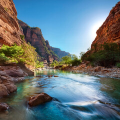 A crystal-clear river flowing through a rocky canyon