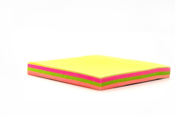 Close-up of a yellow blank sticker on white background, colorful sticky notes