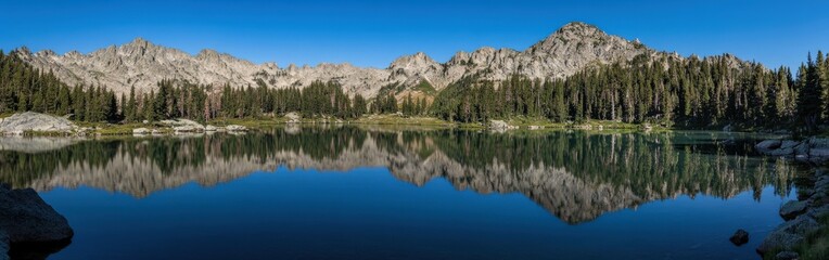 Tranquil mountain lake at sunrise