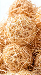 Pile of light beige, fluffy, spherical, natural fiber balls