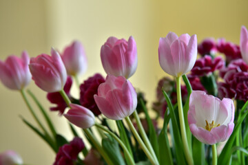 a bouquet of colorful roses and tulips