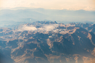 A view of the planet Earth, a view from an airplane, mountains and clouds