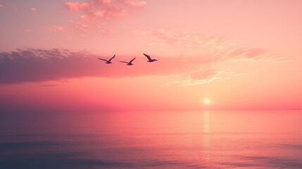 Obraz premium A tranquil evening sky filled with soft pink and orange light, birds flying in a distant formation 