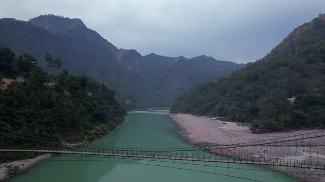 Rishikesh, Uttarakhand, India View of Ganga river embankment, Lakshman Jhula bridge and Tera Manzil Temple, Trimbakeshwar in Rishikesh
