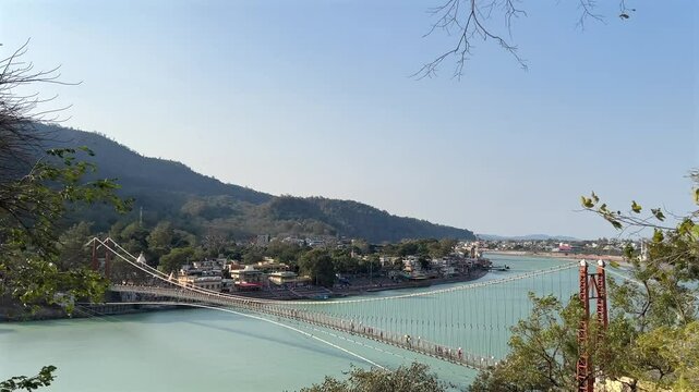Rishikesh, Uttarakhand, India View of Ganga river embankment, Lakshman Jhula bridge and Tera Manzil Temple, Trimbakeshwar in Rishikesh
