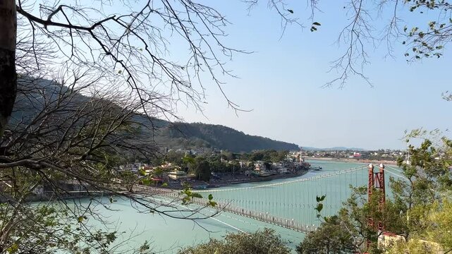 Rishikesh, Uttarakhand, India View of Ganga river embankment, Lakshman Jhula bridge and Tera Manzil Temple, Trimbakeshwar in Rishikesh
