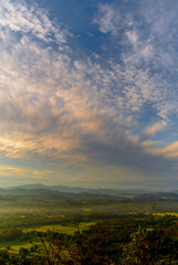 Vertical Beautiful Mountain landscape foggy windy mountain range green landscape asian farm. Vertical Amazing Landscape mountain green field meadow white cloud blue sky sunrise. Countryside scenery