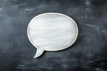 Paper speech bubble on black background with empty space for text