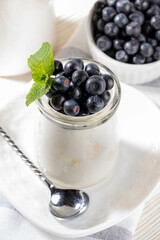 Wholesome probiotic snack. Thick yogurt with blueberries Light and nutritious option for breakfast