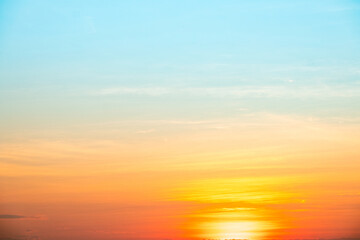 Sky,sunset, beautiful , luxury soft gradient orange gold clouds and sunlight on the blue sky perfect for the background, Sunrise on morning or evening in winter warm time ,Twilight summer,silhouette