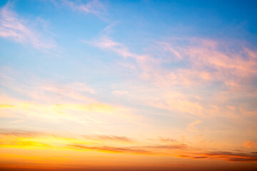 Fototapeta premium Beautiful , luxury soft gradient orange gold clouds and sunlight on the blue sky perfect for the background, take in evening,Twilight, Large size, high definition landscape photo