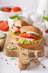 Tasty sandwich with a mix of vegetables and salami.