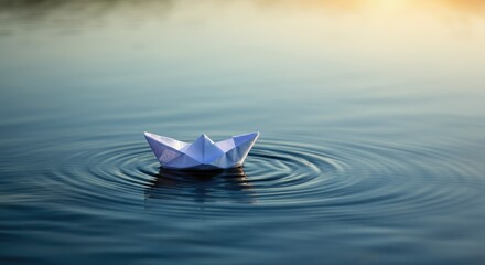 Paper boat floating on calm water at sunset, reflecting tranquility and simplicity