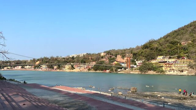 Rishikesh, Uttarakhand, India View of Ganga river embankment, Lakshman Jhula bridge and Tera Manzil Temple, Trimbakeshwar in Rishikesh
