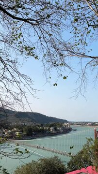Rishikesh, Uttarakhand, India View of Ganga river embankment, Lakshman Jhula bridge and Tera Manzil Temple, Trimbakeshwar in Rishikesh
