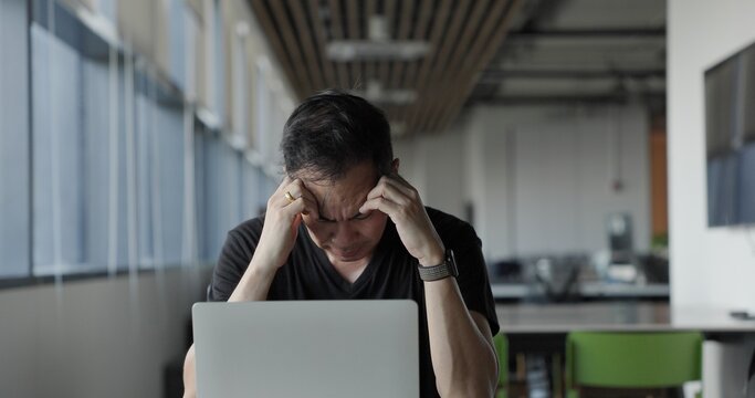 Asian businessman burn out on failed job in office. Elderly office worker expresses emotions Failed to work No success. Financial Communication Business problem. Working too hard overtime