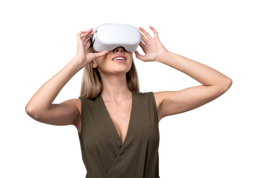 Woman wearing a VR headset, exploring virtual reality. She is smiling while holding the device, isolated on a white background. Concept of modern technology