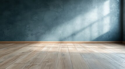 A beautifully lit room showcasing natural sunlight streaming in, highlighting the wooden floor and textured blue wall, creating a calm and inviting atmosphere.