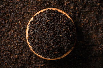 Black tea leaves in bamboo plate. The aroma and smell of the tea drink.