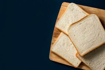 Sliced toast bread on wooden board. The right carbohydrates in nutrition.