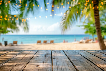 Wooden table top with palm trees, serene view of ocean, tropical beach and decoration of garlands of lights, blurred bokeh summer background with copy space. Empty surface for presentation new product