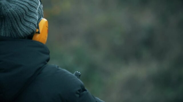 Slow-motion shot of a SIG Sauer P320, a semi-automatic pistol, being fired.