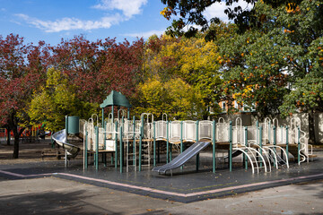 Beautiful Playground with Colorful Trees during Fall in Astoria Queens of New York City