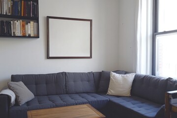 Modern living room interior with sectional sofa, coffee table, bookshelves, and blank frame.
