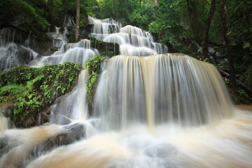 Obraz premium Huay Lao Waterfall is a beautiful limestone waterfall in Namtok Huai Lao Forest Park Phu Luang District, Loei Province, THAILAND 