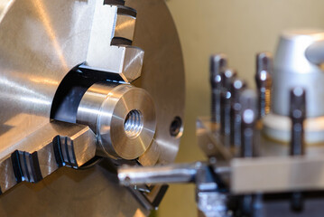The turning machine operation with metal parts.