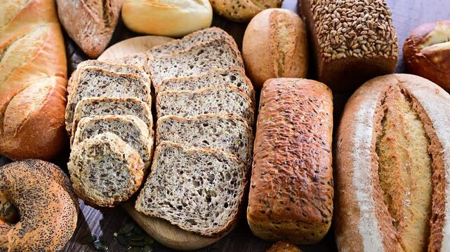 Assorted bakery products including loaves of bread and rolls