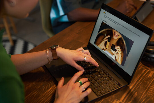 Close-up of young woman using vlm model on laptop to generate image