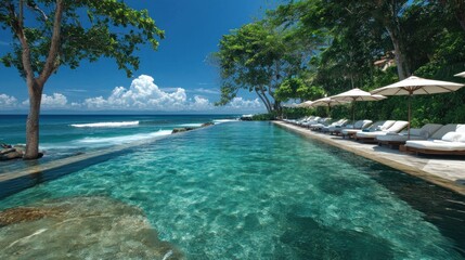 Oceanfront infinity pool, lush tropical scenery