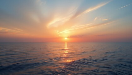 Obraz premium Sunrise over the ocean with the sun reflecting off the water