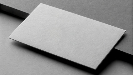 Lawyer business card concept. Gray business card on a textured surface, showcasing a minimalistic design.