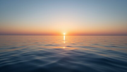 Obraz premium Serene Sunrise Over Calm Ocean Waters Creating a Peaceful Reflection on the Water Surface