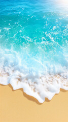 Obraz premium Soft foam bubbles crest as turquoise waters roll onto the golden sand of a beach, highlighting a serene atmosphere. Sunlight sparkles on the water, creating a picturesque coastal scene