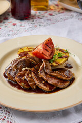 Gourmet Demiglace Tongue Dish with Grilled Potato and Tomato Rich Color Palette in Bright Ambient Light