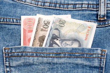 Luxembourg franc in the pocket of blue jeans