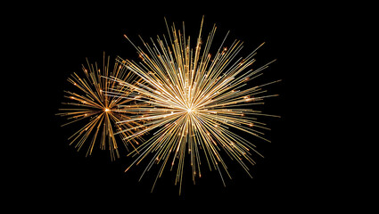 Fototapeta premium Stunning Golden Fireworks Explosion Against a Dark Night Sky – High-Quality Display